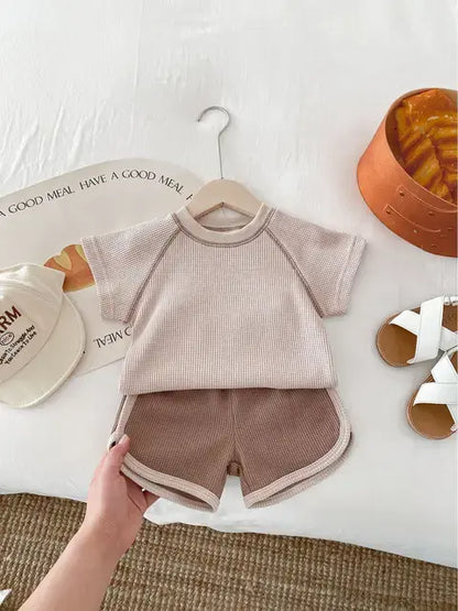 Oberteil und Knopf aus reiner Baby-Baumwolle